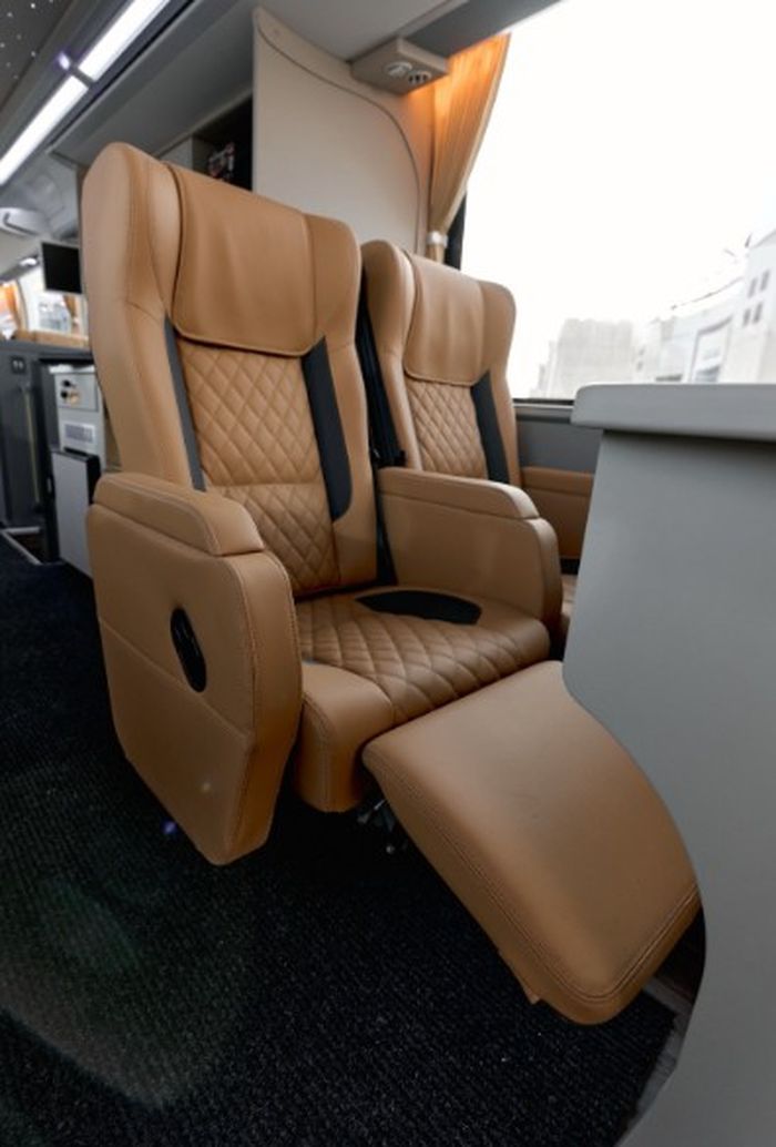 Premium reclining seat with footrest on our VIP Luxury Coach